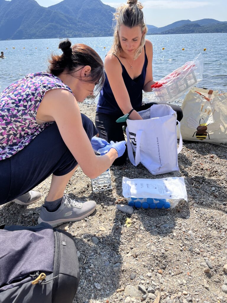 Figure 2 - Researchers Angelina Cordone and Estrer Eckert while collecting samples from the shores of Lake Maggiore